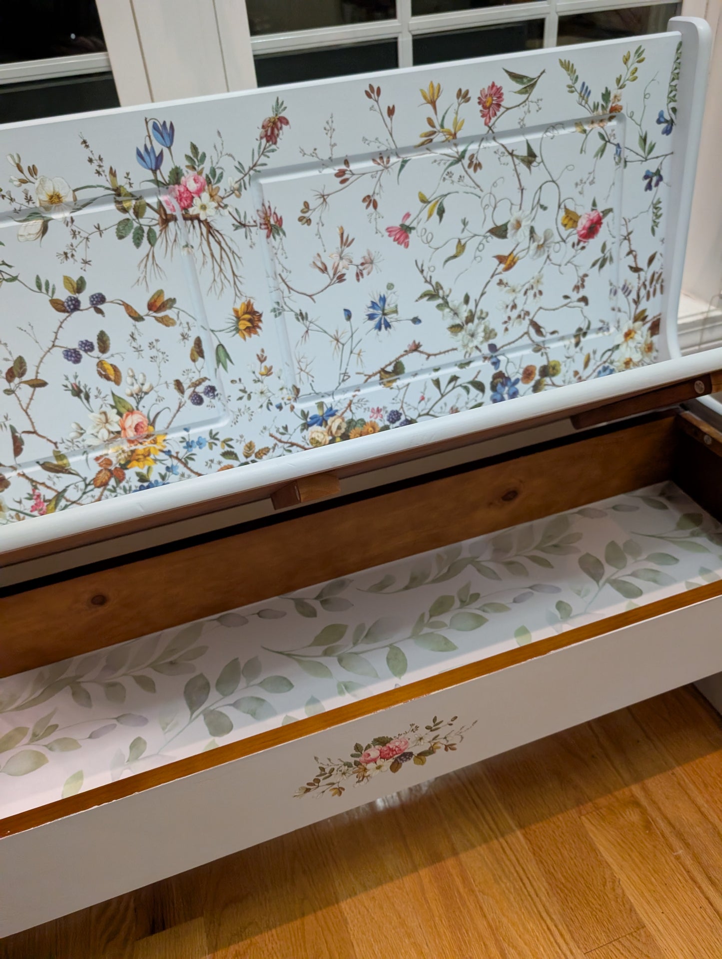 Wooden bench with floral-patterned top and seat