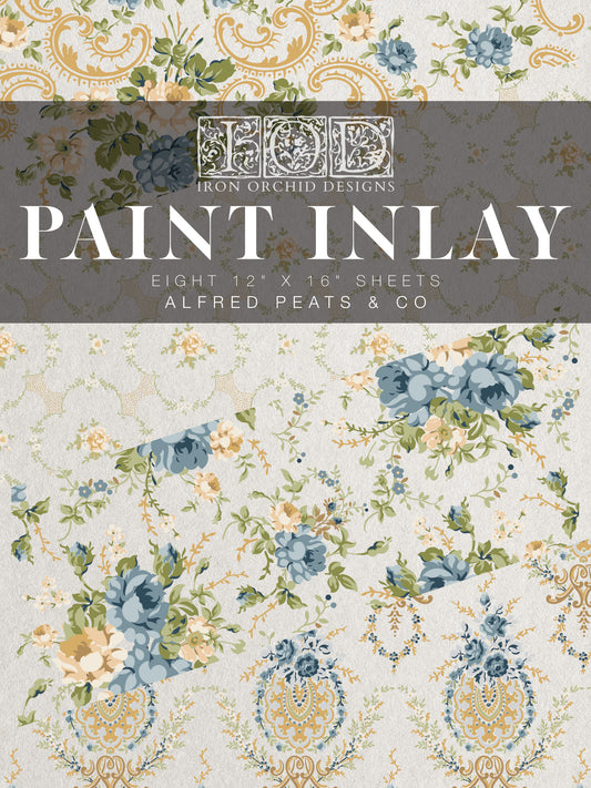 Packaging of Iron Orchid Designs Paint Inlay with floral patterns and brand name.