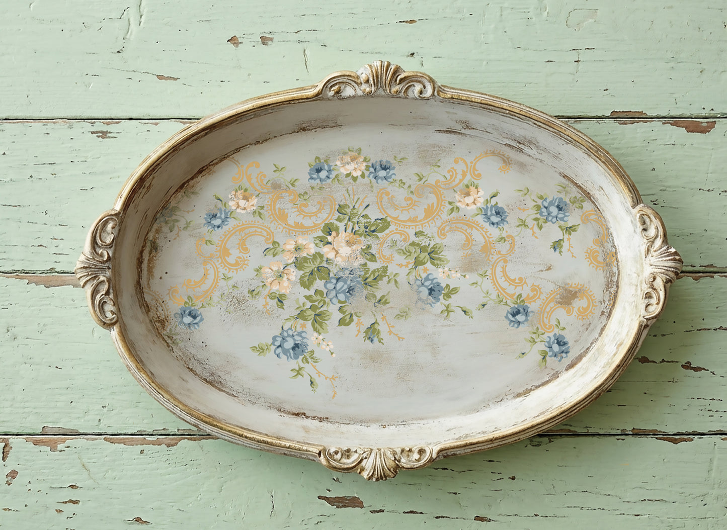 Decorative oval tray with floral design on a rustic wooden surface