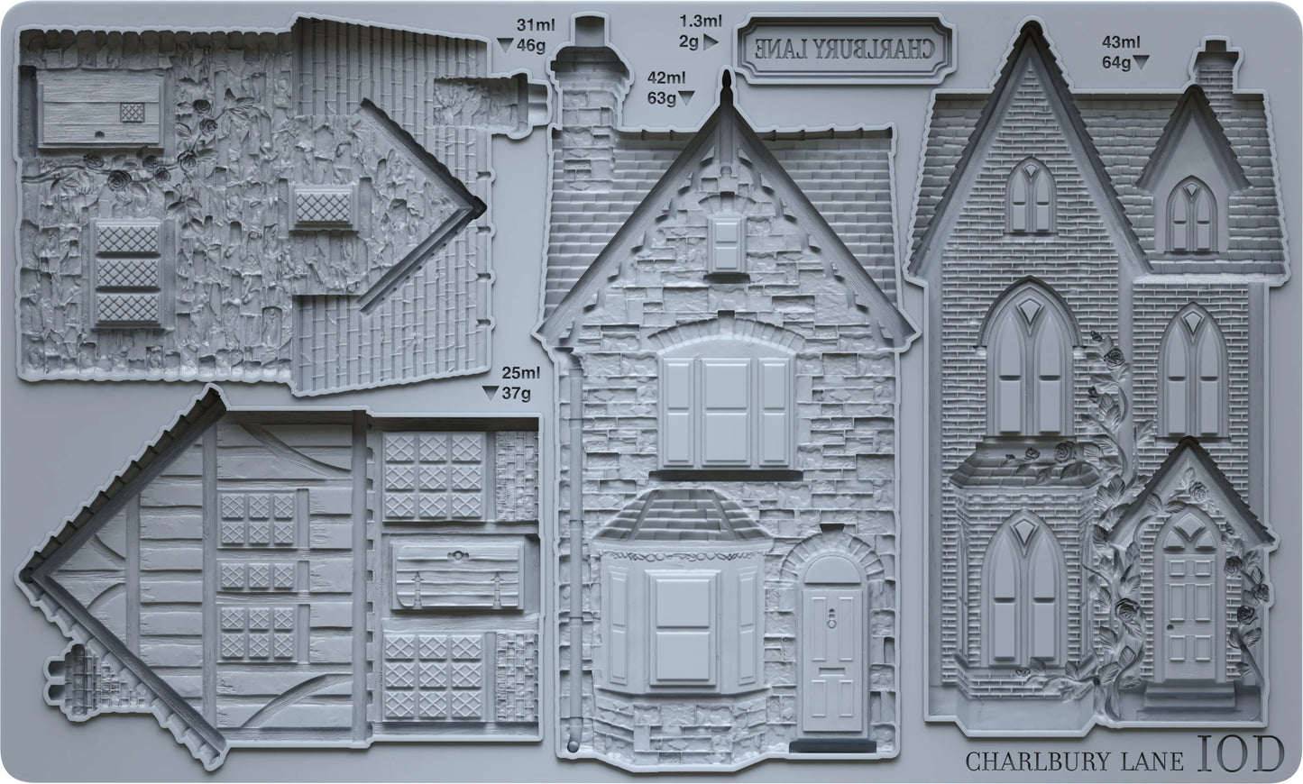 A gray plastic mold tray featuring detailed embossed house designs and architectural sections, with printed labels including 'SHALVISTURD', 'CHARLUBY LANE 10D', and capacity text in milliliters and grams.