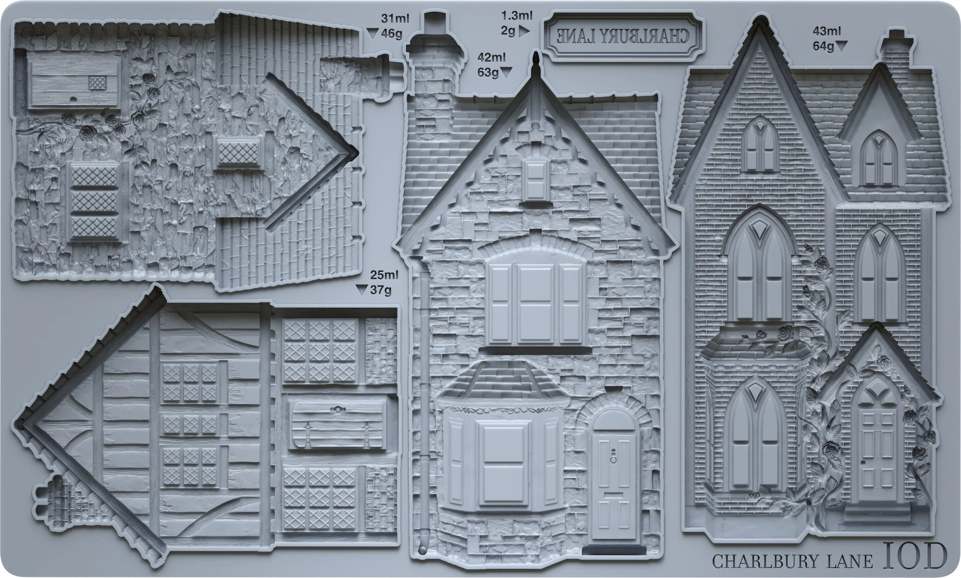 A gray plastic mold tray featuring detailed embossed house designs and architectural sections, with printed labels including 'SHALVISTURD', 'CHARLUBY LANE 10D', and capacity text in milliliters and grams.