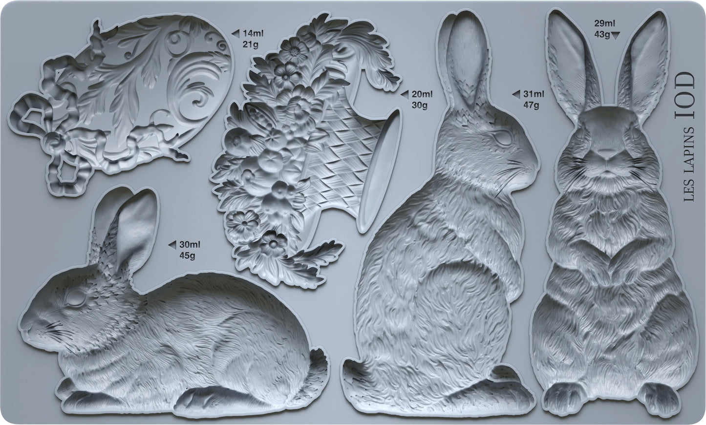 Set of molds shaped as bunnies, flowers,  on a gray background