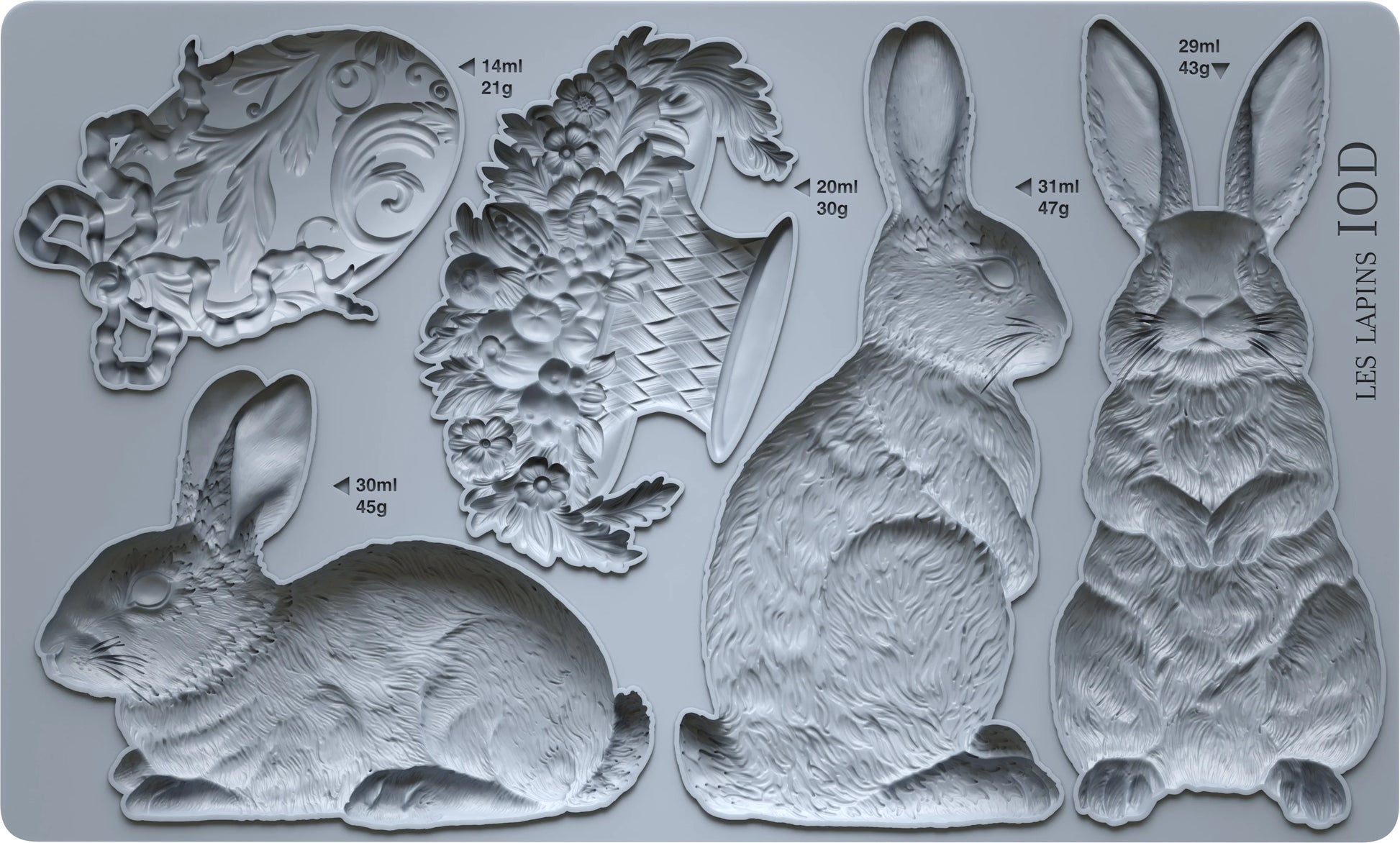 Set of molds shaped as bunnies, flowers,  on a gray background