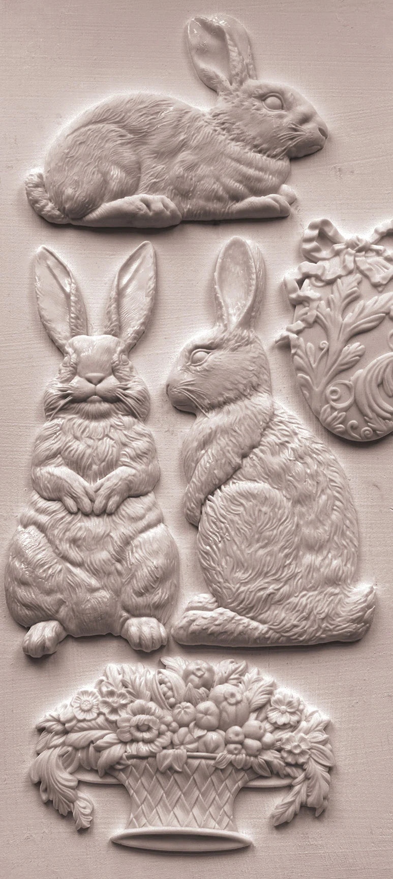 Decorative embossed images of rabbits and floral baskets on a beige background