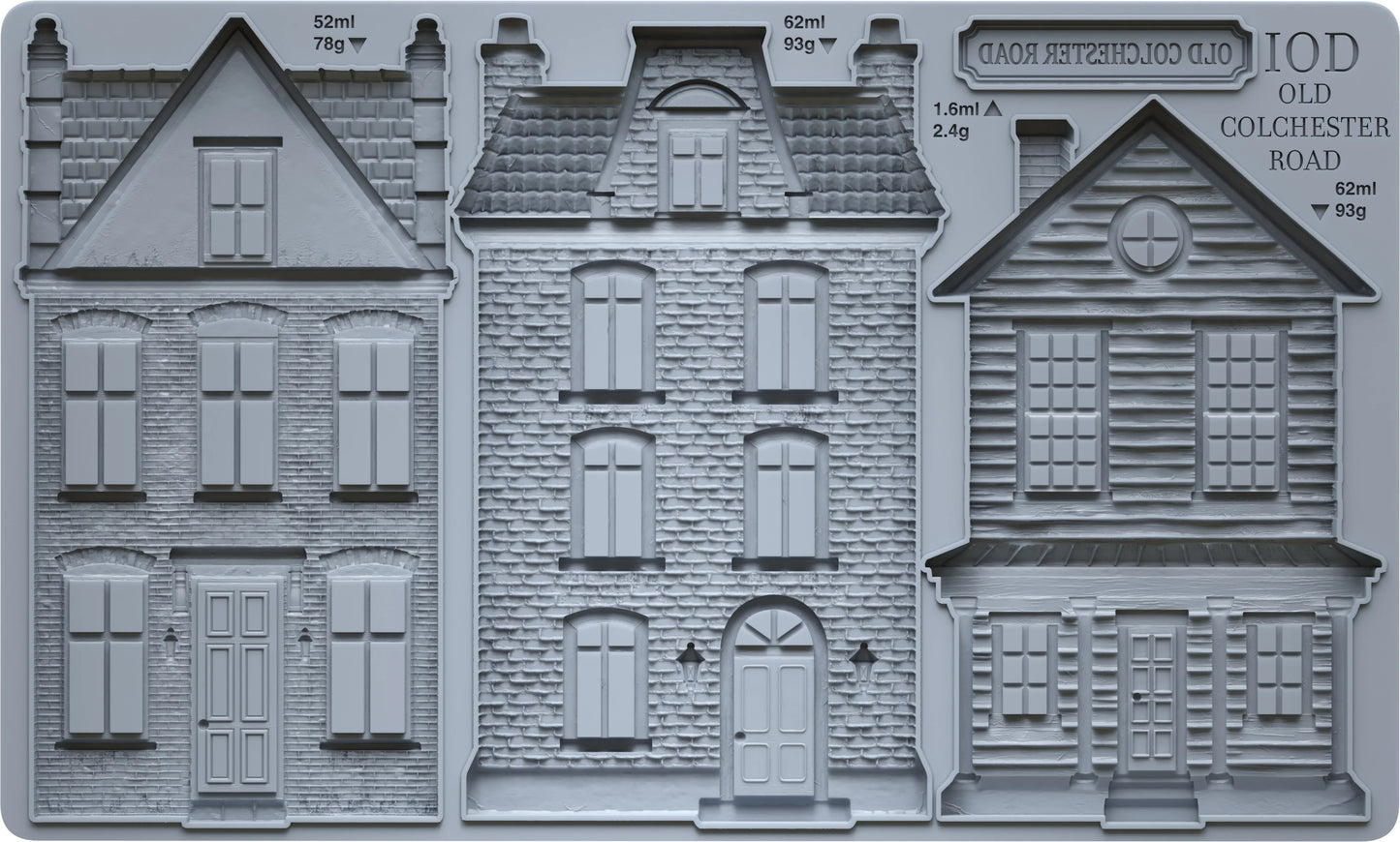 Three gray miniature house molds or relief designs shown side by side, with printed text reading 'IOD OLD COLCHESTER ROAD' and small measurements above each building.