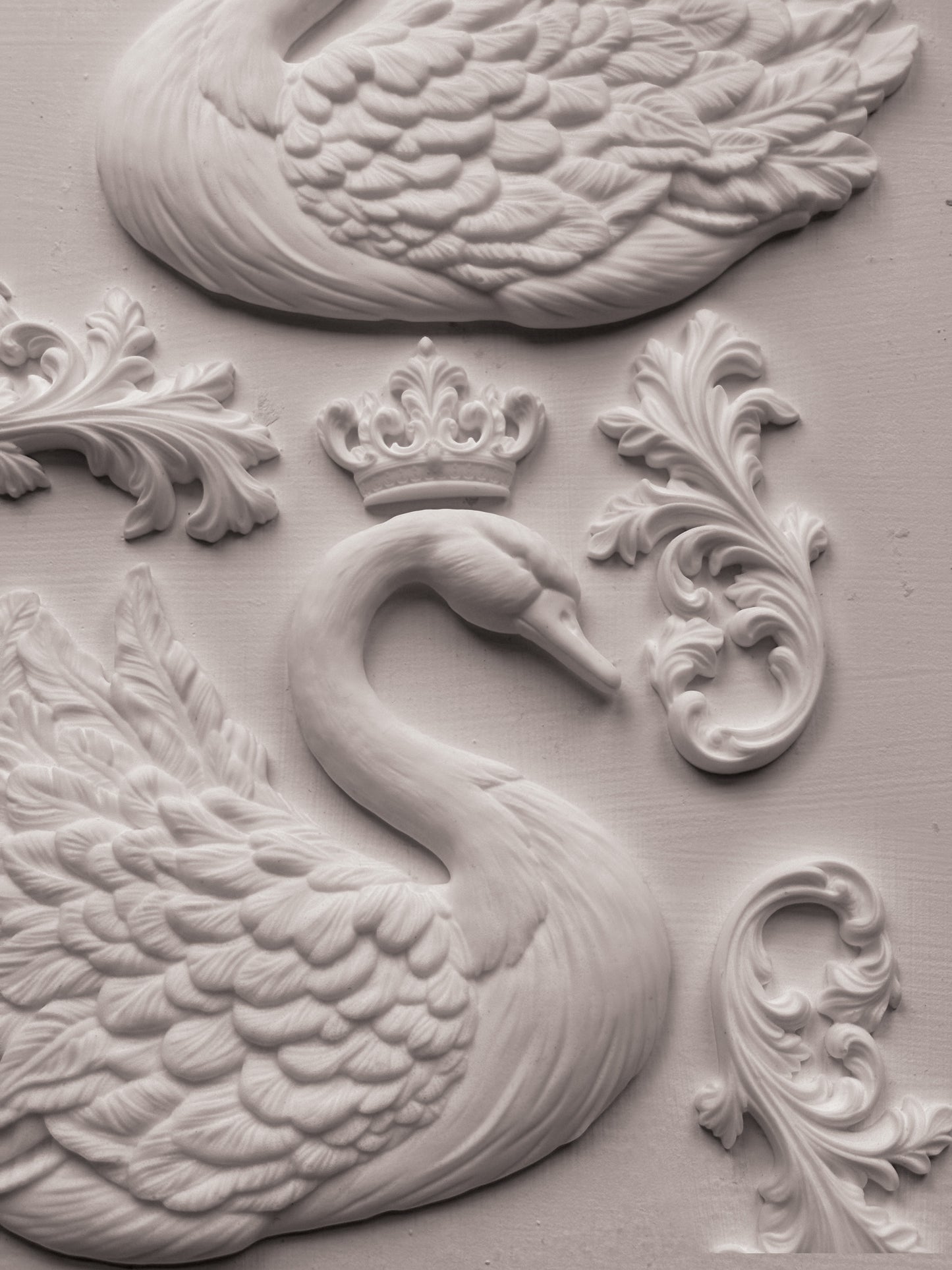 Decorative wall piece with swan design and crown