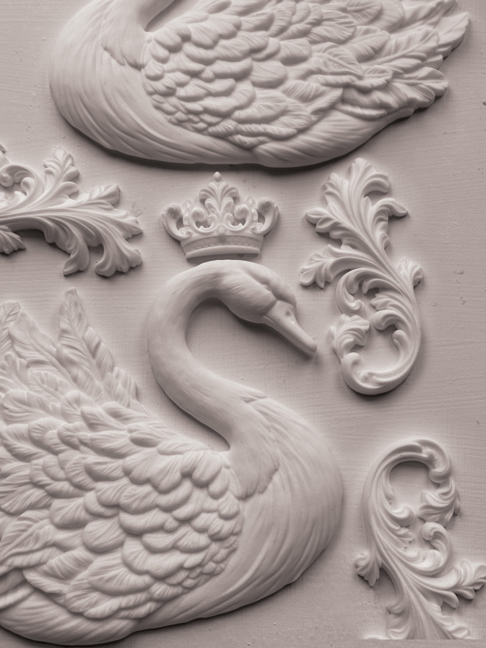 Decorative wall piece with swan design and crown