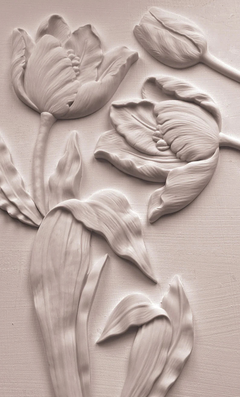 Decorative relief of tulips on a textured beige background