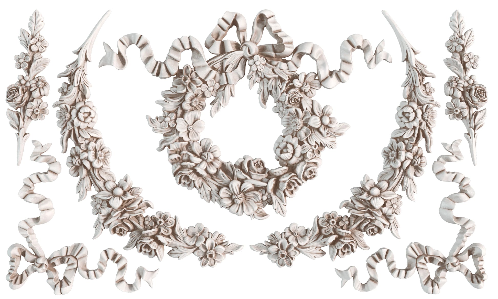 Decorative floral and ribbon molds on a white background