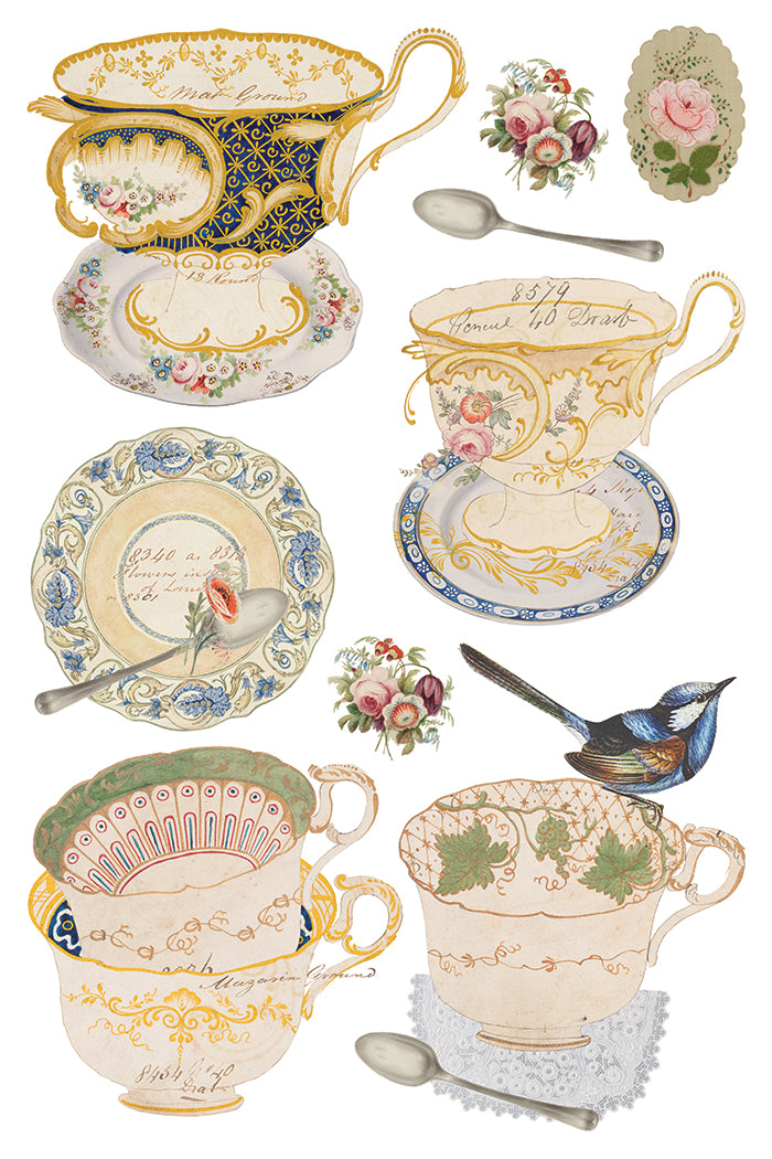 Collection of decorative teacups, saucers, and spoons with floral and intricate designs on a white background.