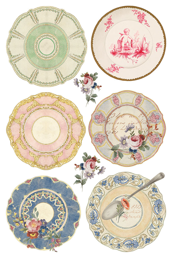 Set of decorative plates with floral and vintage designs on a white background.