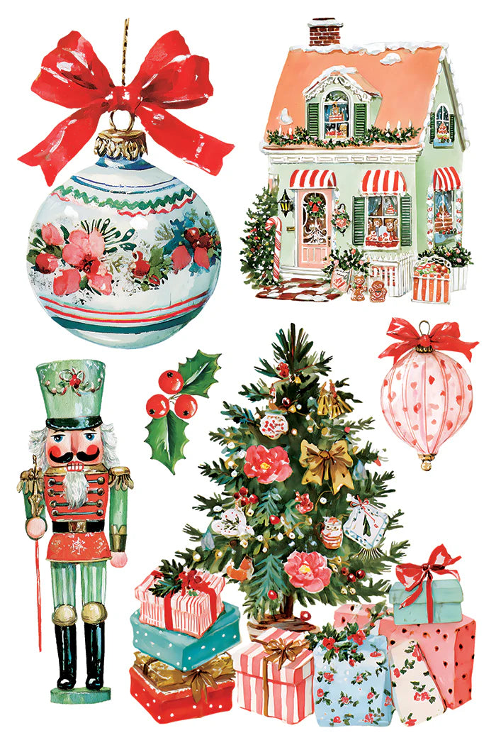 A collection of Christmas-themed clipart illustrations on a white background, including a large ornament with a red bow, a decorated house, a nutcracker, a Christmas tree with gifts, and a pink patterned hot air balloon.