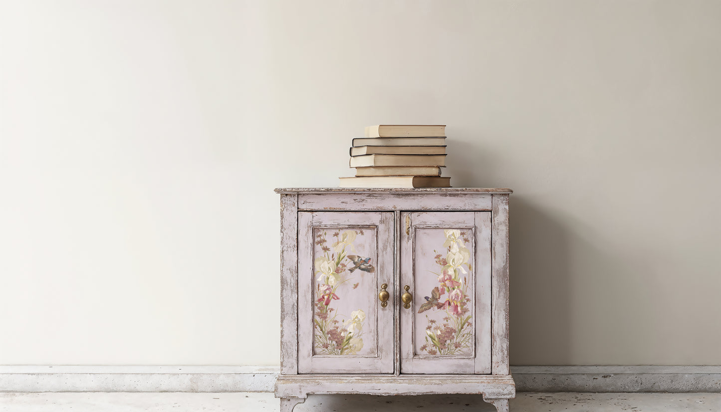 Vintage-style cabinet with floral designs on a white wall